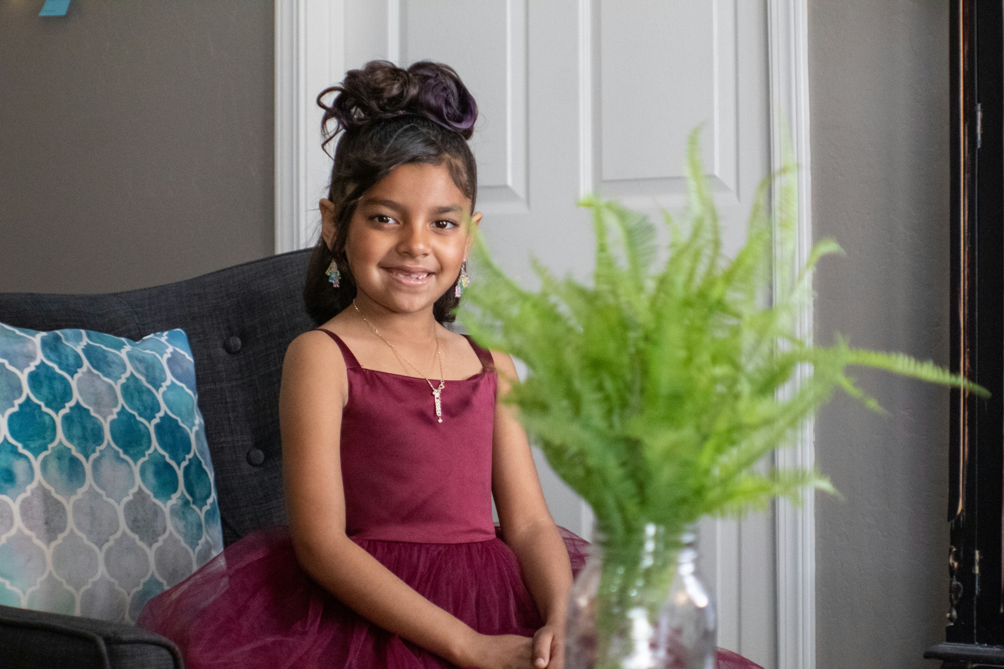 Child with a styled updo hairstyle